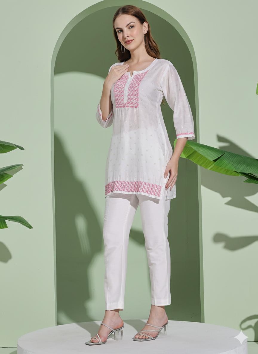 Women White Chanderi Hand Chikankari Short Kurta with pink embroidered detailing on neckline, sleeves.