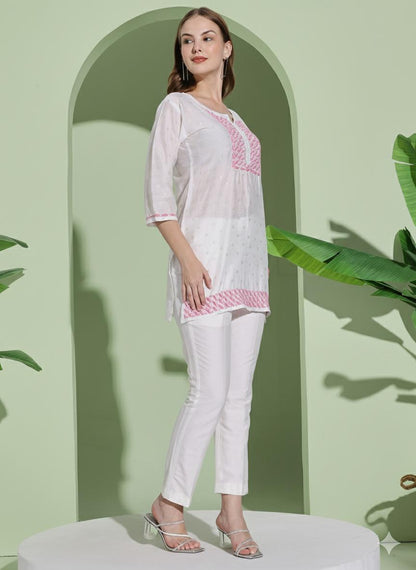 Women White Chanderi Hand Chikankari Short Kurta with pink embroidered detailing on neckline, sleeves.