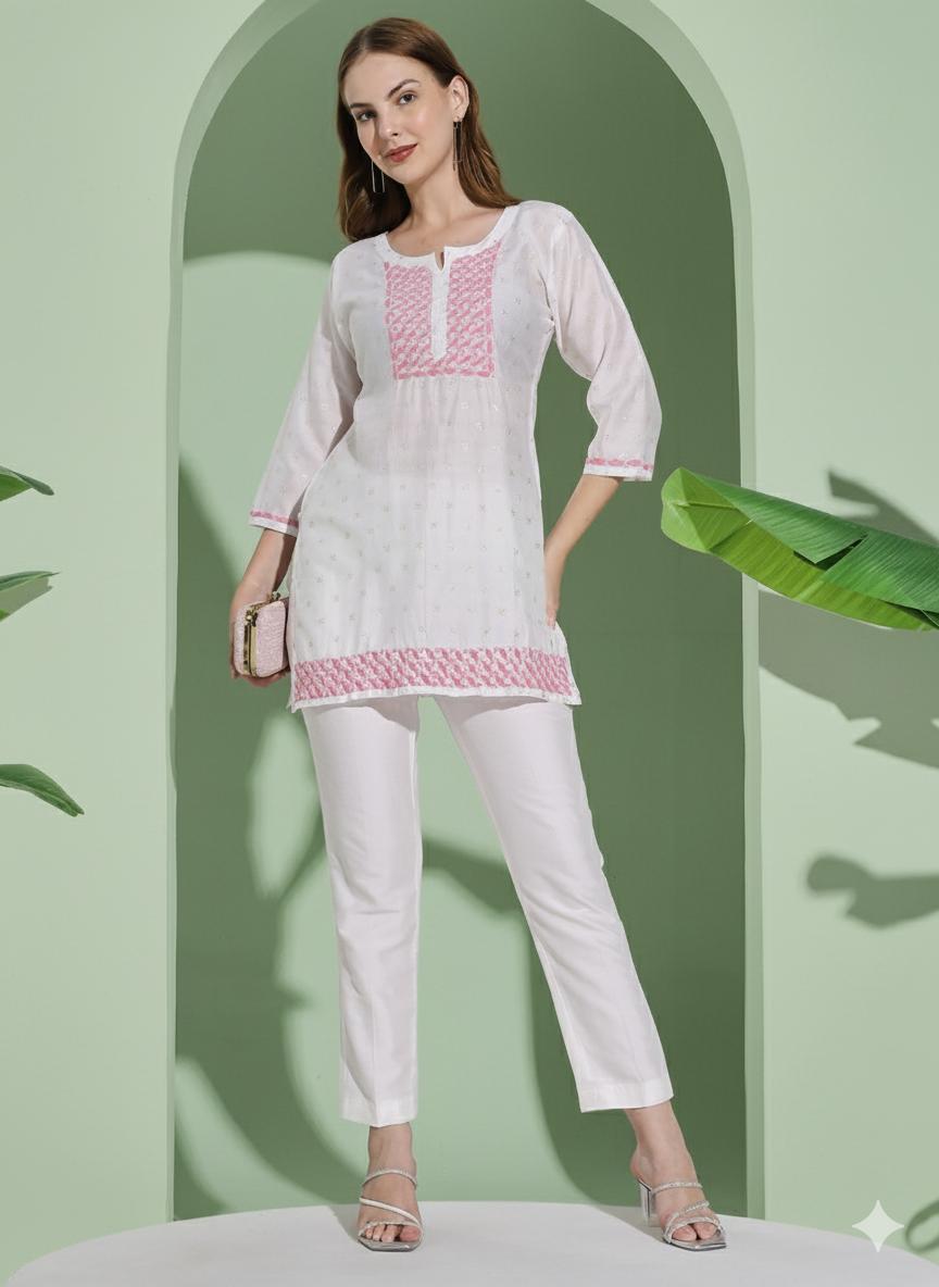 Women White Chanderi Hand Chikankari Short Kurta with pink embroidered detailing on neckline, sleeves.