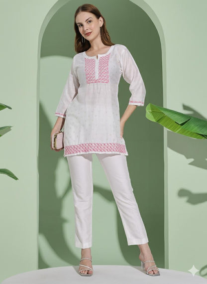 Women White Chanderi Hand Chikankari Short Kurta with pink embroidered detailing on neckline, sleeves.